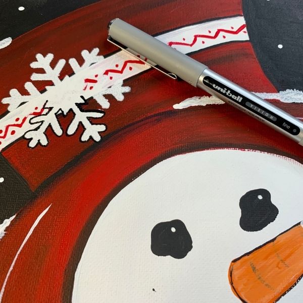 snowman with stenciled snowflake